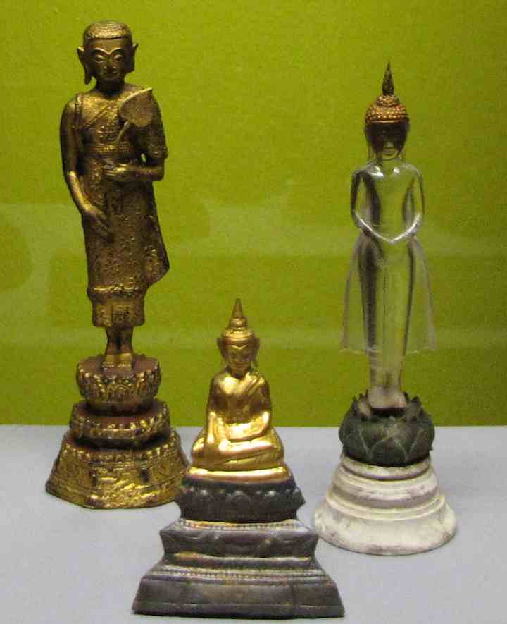 3 small buddha statues, including one in crystal at the Asian Civilization Museum in Singapore